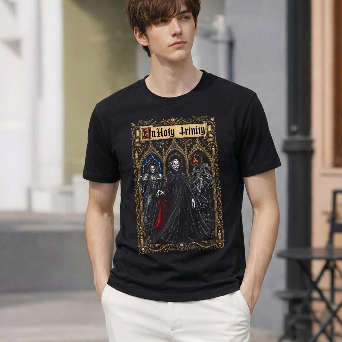 Man wearing the UnHoly Trinity gothic horror t-shirt with white pants